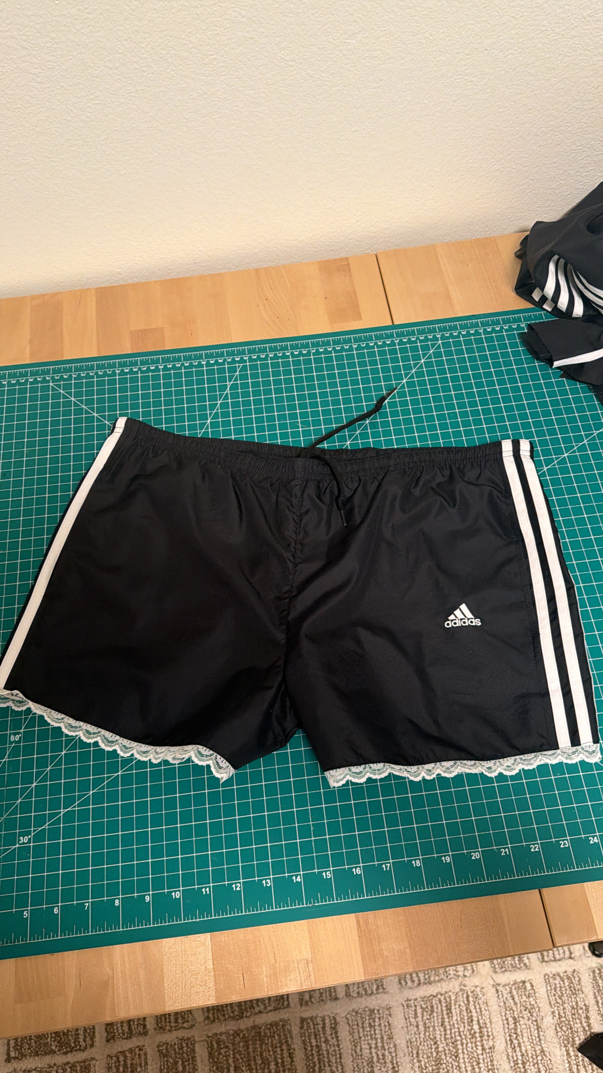 The finished lace-trim Adidas shorts